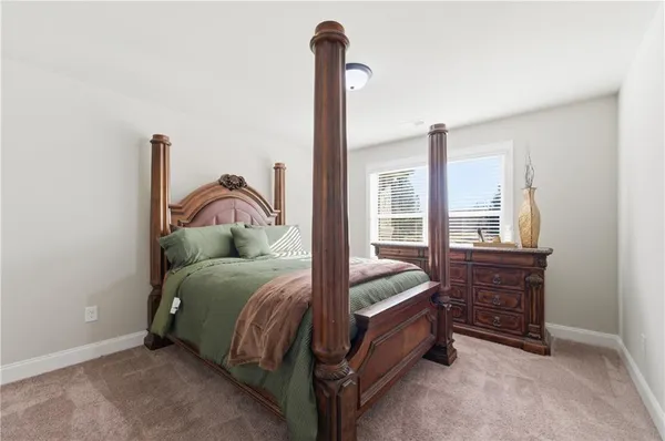 a bed room with a bed and a window