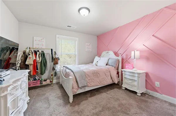 a bed room with a bed and a walk in closet