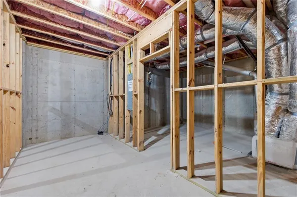 a bathroom with a shower and a glass door