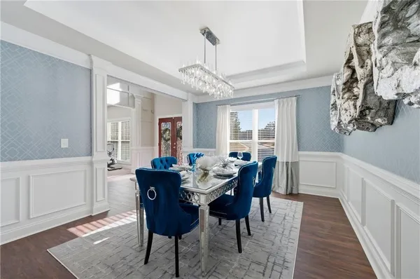 a view of a dining room with furniture window and wooden floor