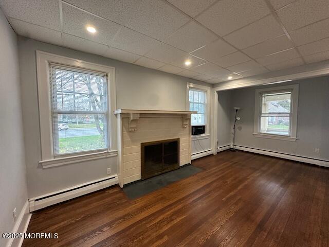 316 Spier Avenue, Unit 1 Allenhurst, NJ 07711 - Photo 6 of 9 an empty room with wooden floor fireplace and windows