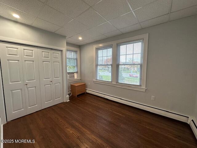 316 Spier Avenue, Unit 1 Allenhurst, NJ 07711 - Photo 8 of 9 an empty room with wooden floor and windows