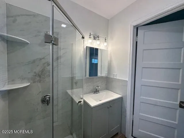 a bathroom with a sink and mirror