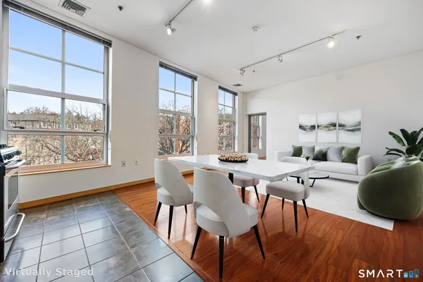 a view of a dining room with furniture window and outside view