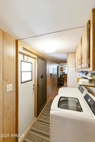 a kitchen that has a sink and a refrigerator
