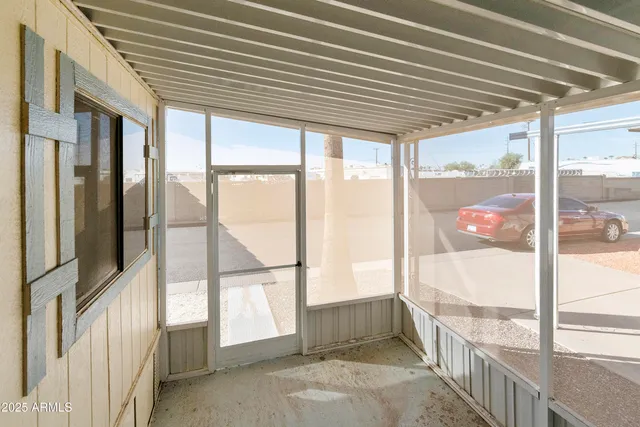 a view of the patio with dining table and chairs