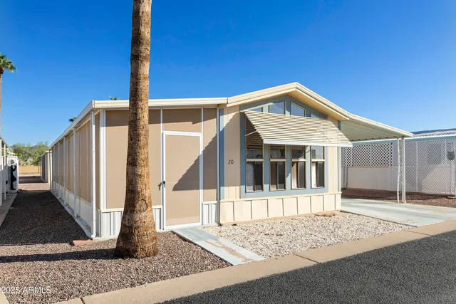 a front view of a house with wooden fence