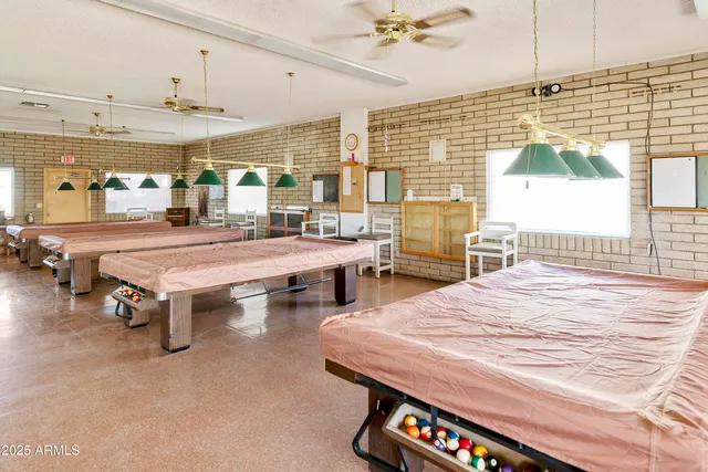 a kitchen with cabinets a sink and white stainless steel appliances