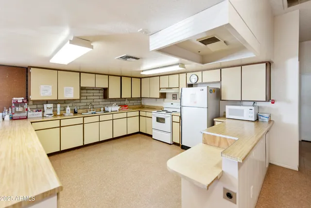 a view of a workspace with furniture and toys