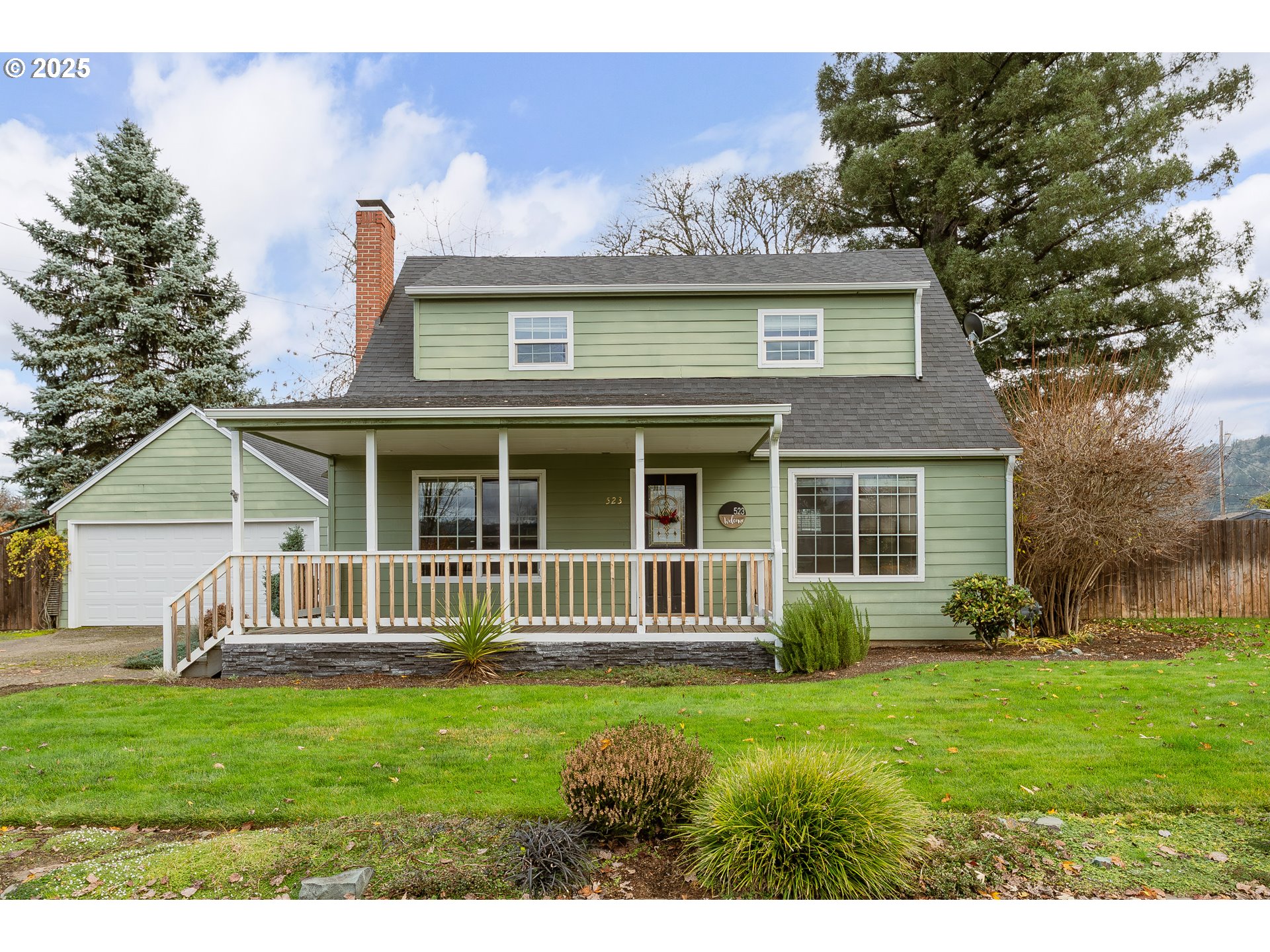 a front view of a house with garden