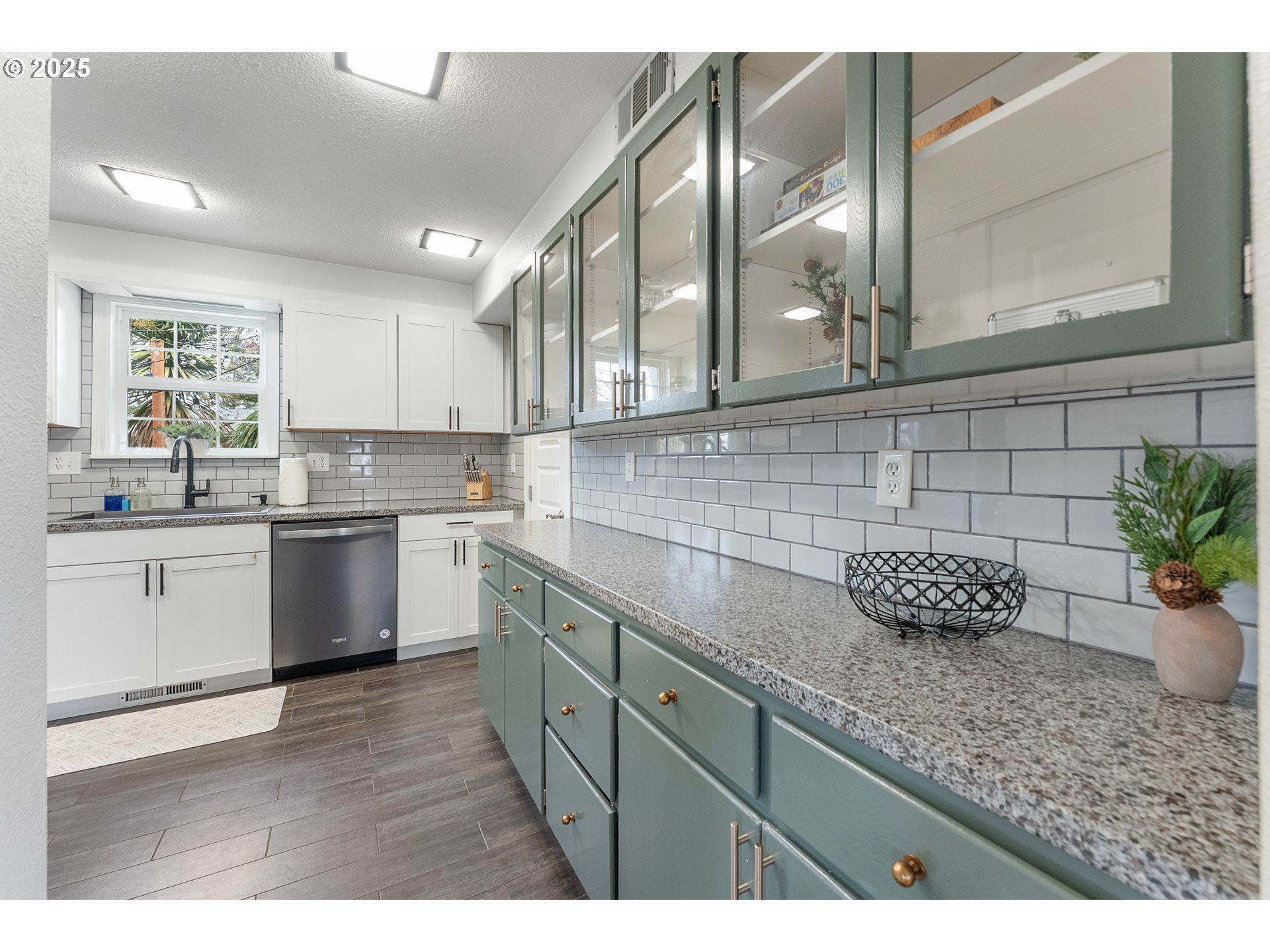 523 West Broccoli Street Roseburg, OR 97471 - Photo 11 of 43 a kitchen with stainless steel appliances kitchen island granite countertop a sink and cabinets