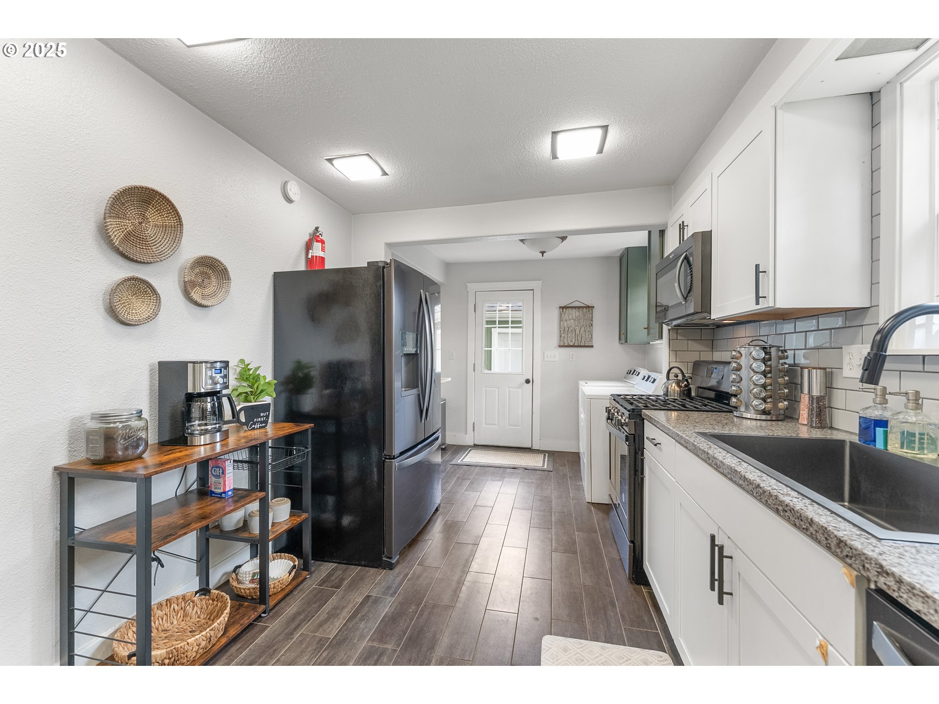 523 West Broccoli Street Roseburg, OR 97471 - Photo 13 of 43 a kitchen with granite countertop a refrigerator stove top oven and sink