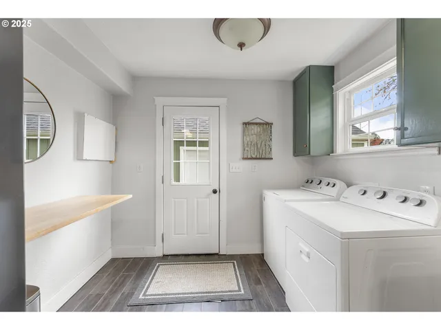 a bathroom with a sink a window and mirror