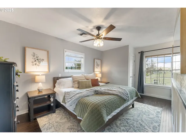 a bedroom with a large bed and a window