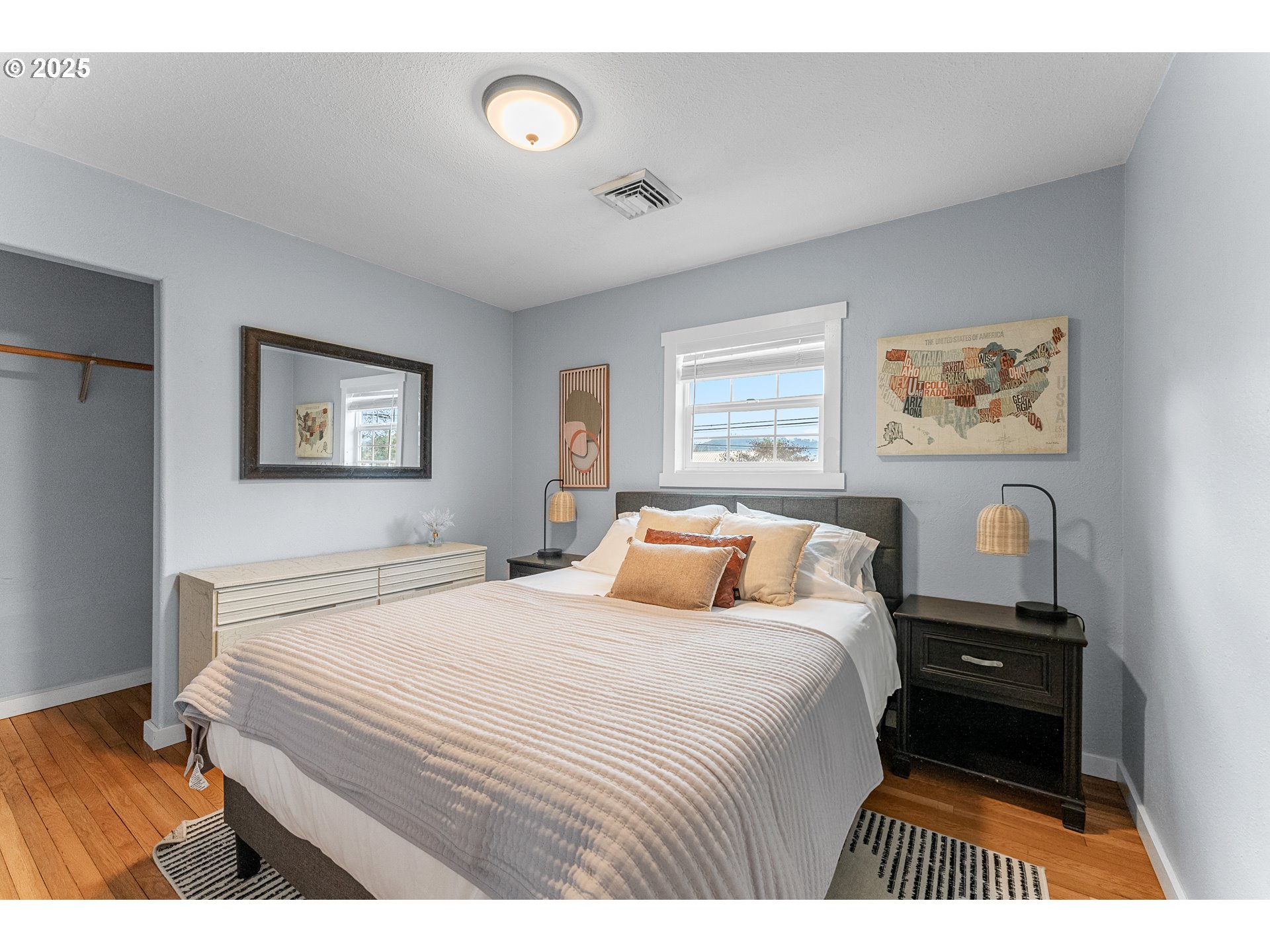 523 West Broccoli Street Roseburg, OR 97471 - Photo 26 of 43 a bedroom with a bed and a painting on the wall