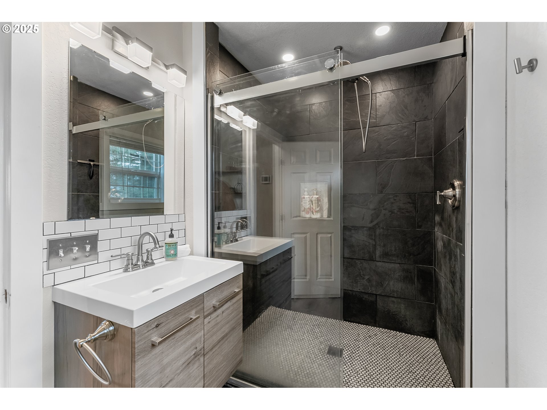 523 West Broccoli Street Roseburg, OR 97471 - Photo 30 of 43 a bathroom with a sink mirror and a shower