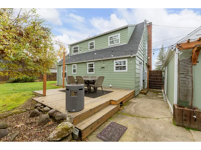 a view of a backyard with sitting area