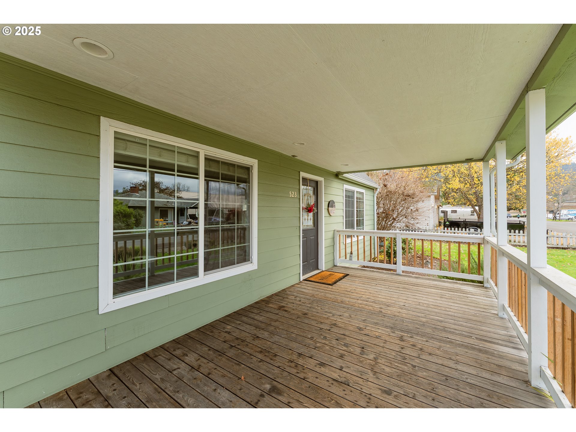 523 West Broccoli Street Roseburg, OR 97471 - Photo 4 of 43 a view of an empty room with wooden floor and a window