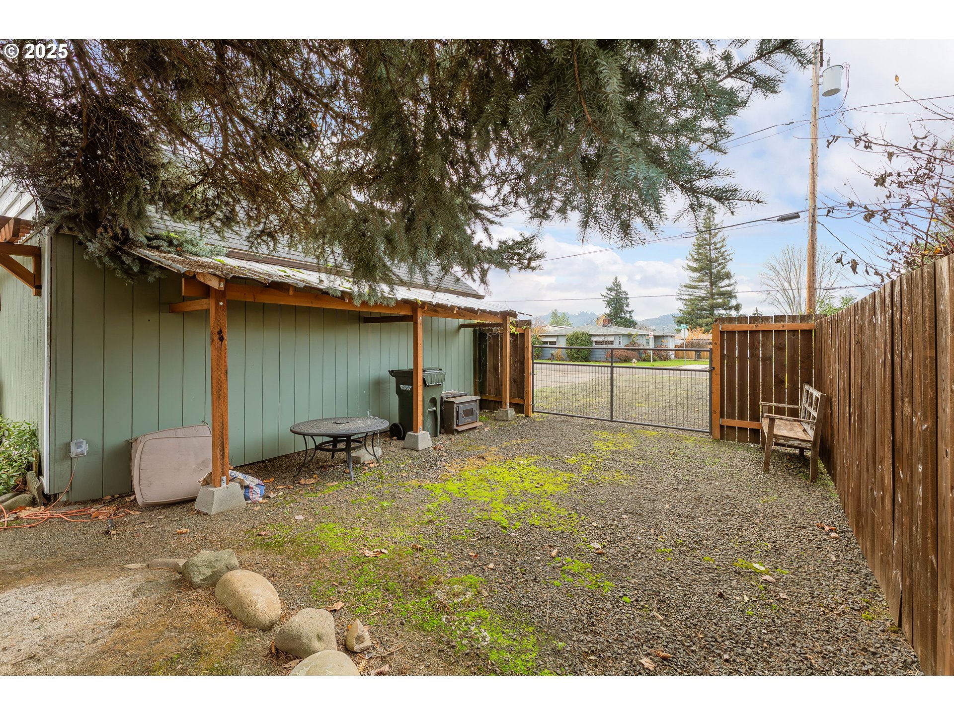 523 West Broccoli Street Roseburg, OR 97471 - Photo 41 of 43 a backyard of a house with barbeque oven table and chairs