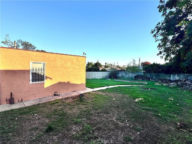a view of a yard with an outdoor space and seating