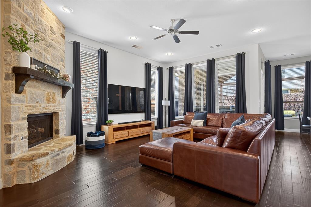 1010 Longhill Way Forney, TX 75126 - Photo 14 of 38 a living room with furniture fireplace and flat screen tv