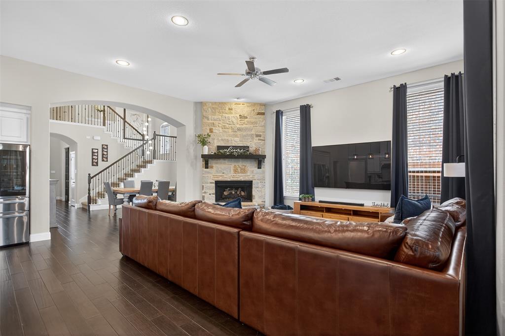 1010 Longhill Way Forney, TX 75126 - Photo 18 of 38 a living room with fireplace furniture and a large window