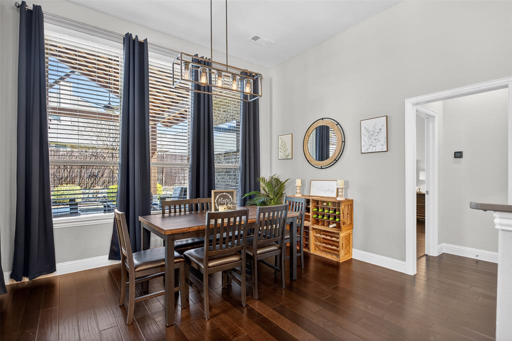 1010 Longhill Way Forney, TX 75126 - Photo 19 of 38 a view of a dining room with furniture window and wooden floor