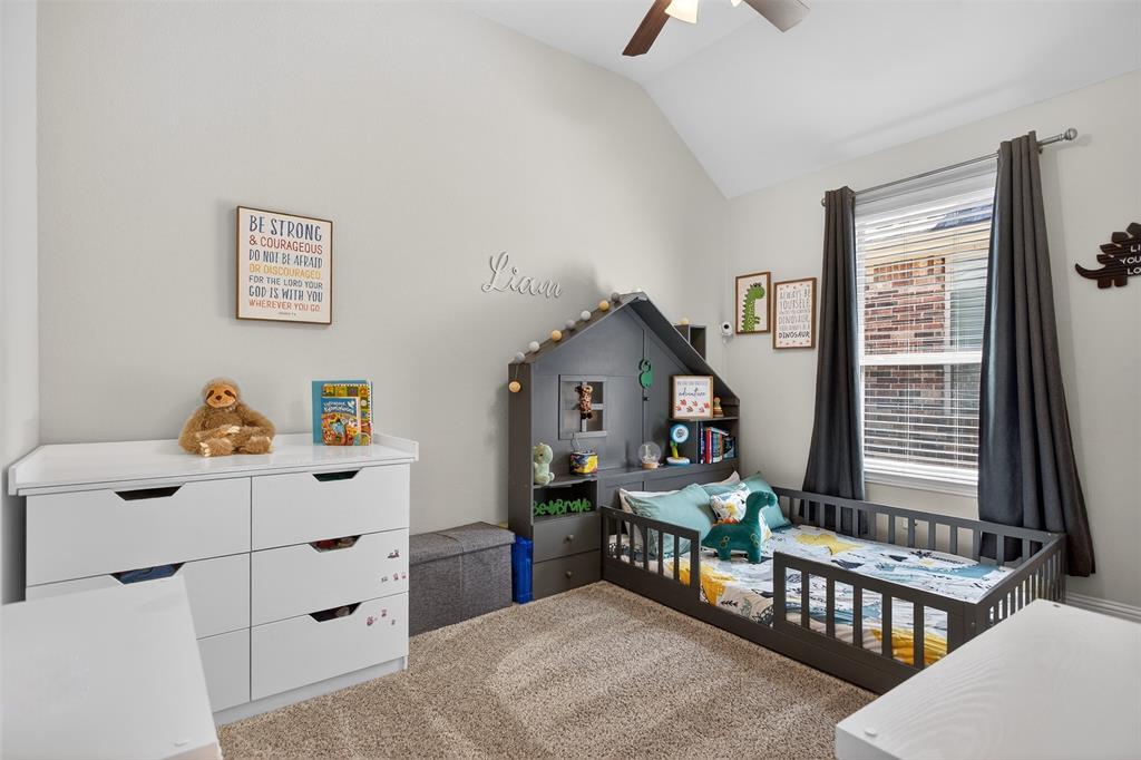 1010 Longhill Way Forney, TX 75126 - Photo 22 of 38 a bedroom with furniture a baby crib and a window