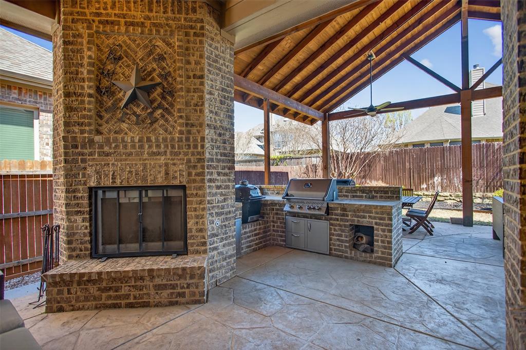 1010 Longhill Way Forney, TX 75126 - Photo 28 of 38 a view of barbecue grill with dining table and chairs