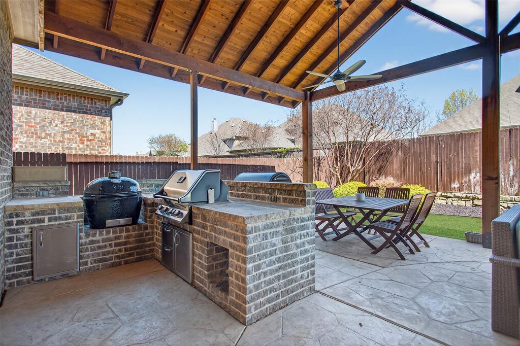 1010 Longhill Way Forney, TX 75126 - Photo 30 of 38 a patio with yard table and chairs