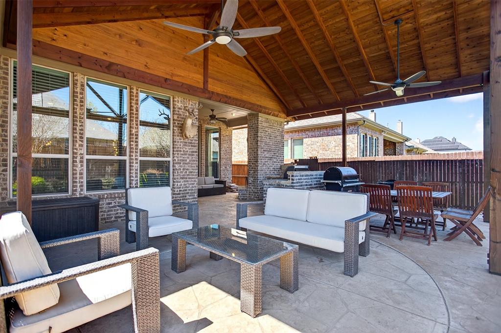 1010 Longhill Way Forney, TX 75126 - Photo 3 of 38 a living room with furniture a wooden floor and a large window