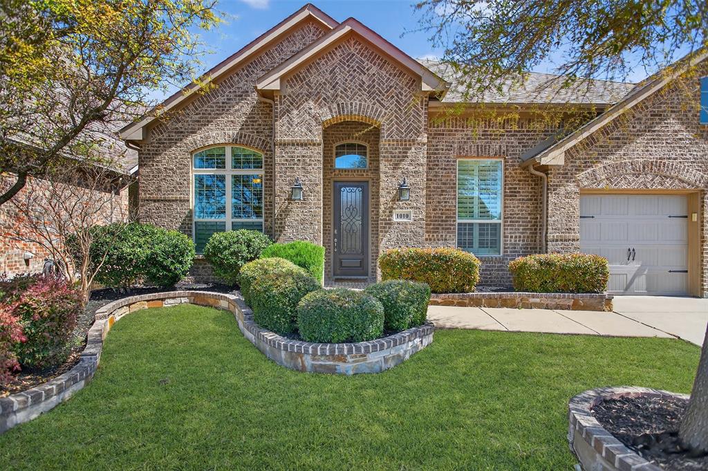 1010 Longhill Way Forney, TX 75126 - Photo 32 of 38 a front view of a house with a yard