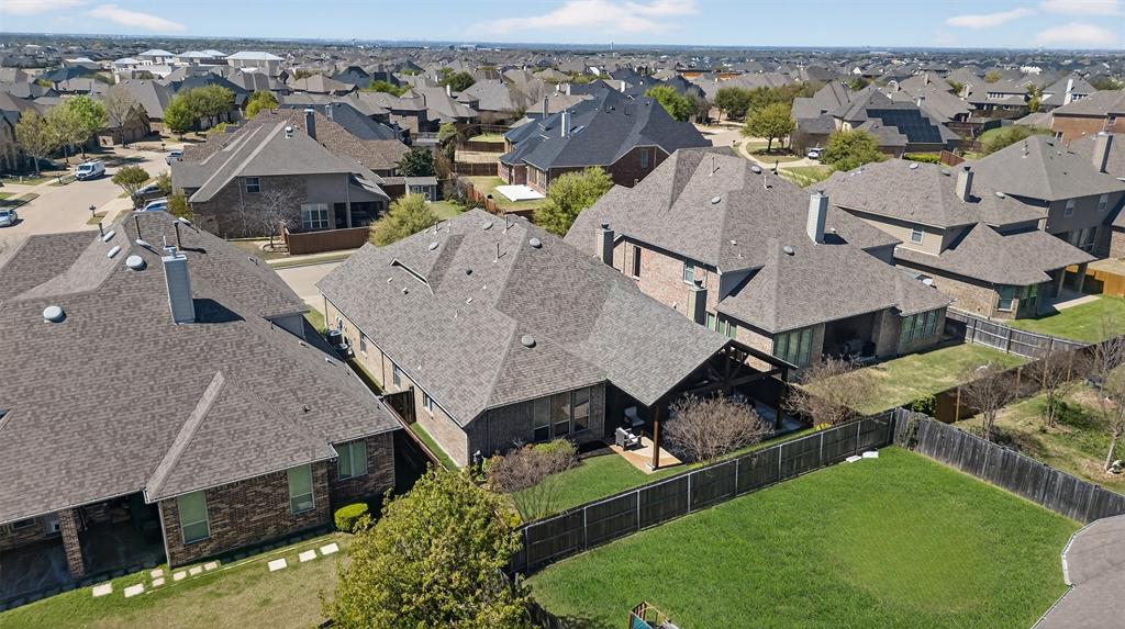 1010 Longhill Way Forney, TX 75126 - Photo 35 of 38 an aerial view of a house with swimming pool and a yard
