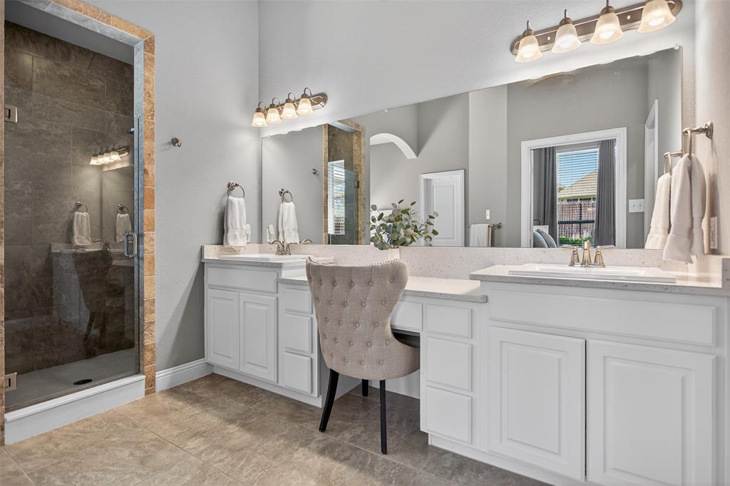 1010 Longhill Way Forney, TX 75126 - Photo 6 of 38 a bathroom with a sink vanity and a mirror