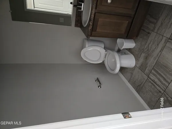 a bathroom with a toilet and a sink