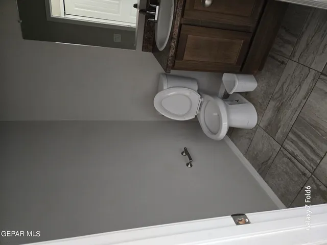 a bathroom with a toilet and a sink