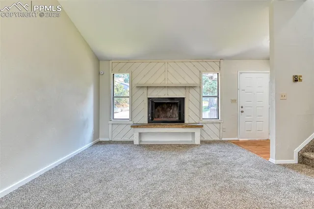 an empty room with fireplace