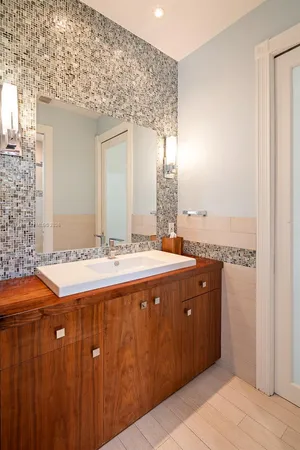 a bathroom with a sink and a mirror