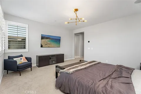 a bedroom with a bed and a couch