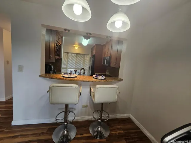 a bathroom with a sink mirror and vanity