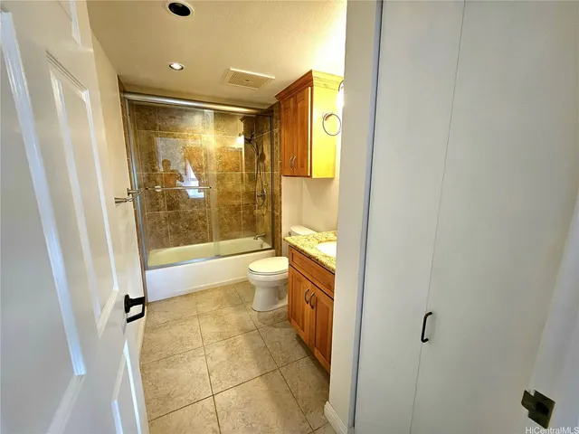 a bathroom with a tub and shower