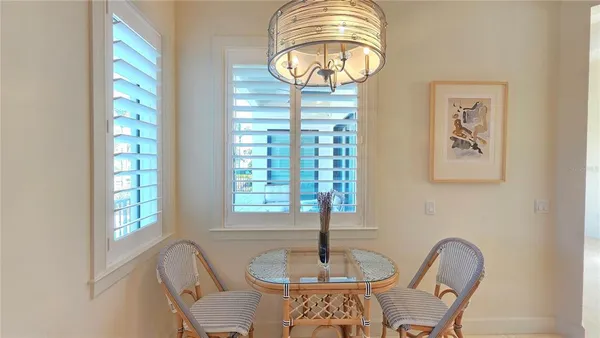 a front view of a dining room with furniture window and outside view