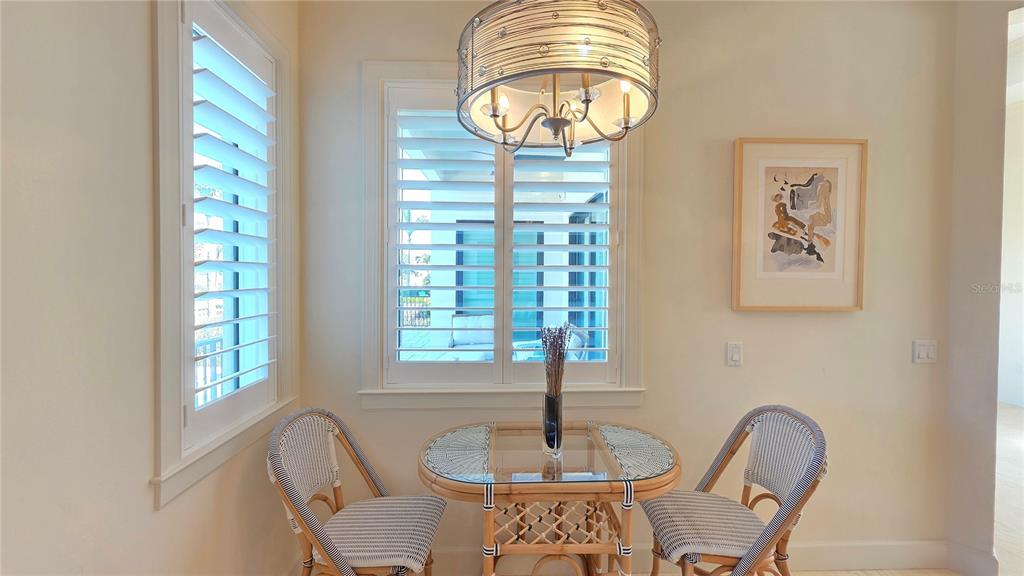 531 Birdie Lane Longboat Key, FL 34228 - Photo 12 of 43 a front view of a dining room with furniture window and outside view