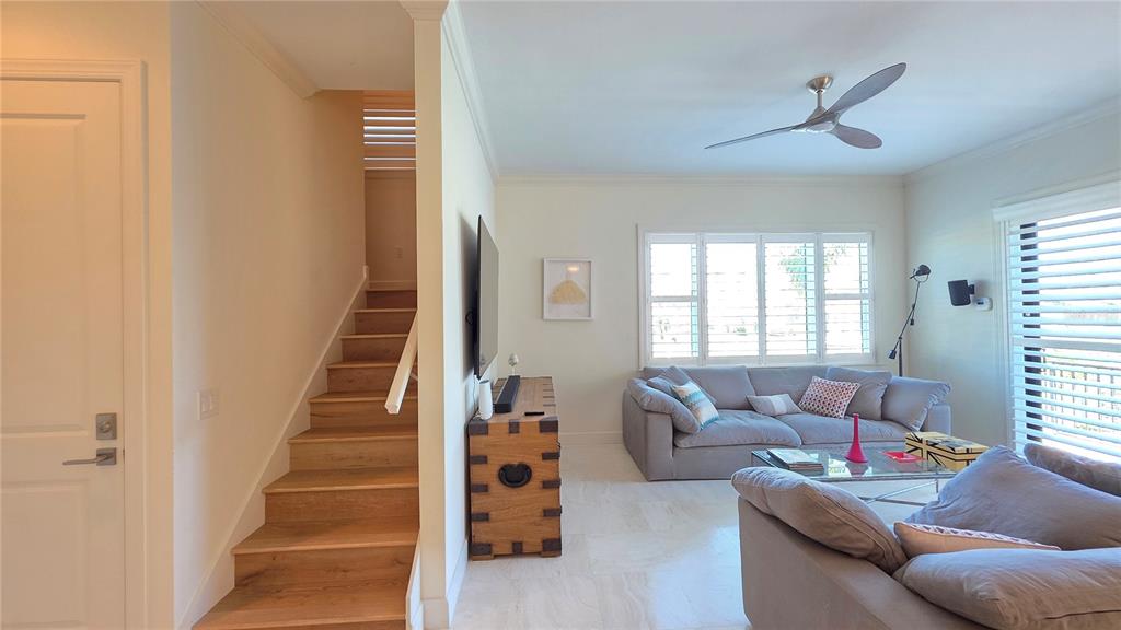 531 Birdie Lane Longboat Key, FL 34228 - Photo 15 of 43 a living room with furniture and a window