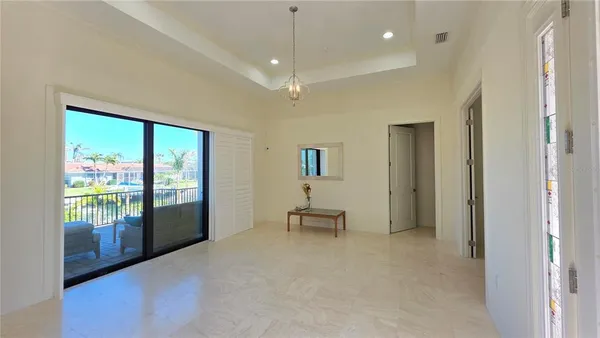 a view of an empty room with glass door