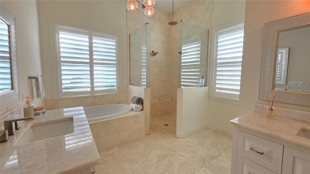 531 Birdie Lane Longboat Key, FL 34228 - Photo 21 of 43 a bath room with a sink and a bath tub
