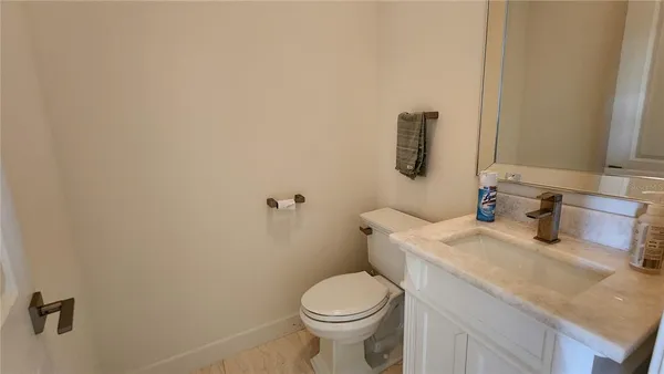 a bathroom with a sink and toilet