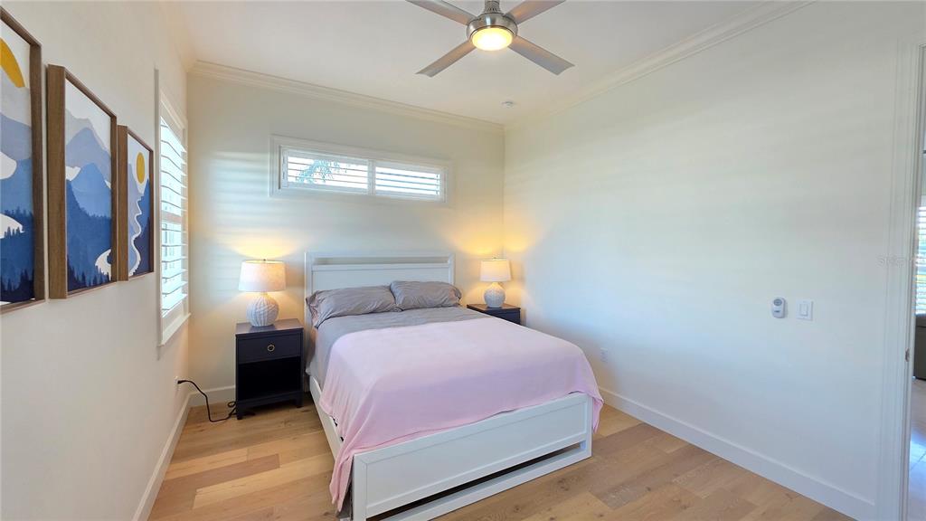 531 Birdie Lane Longboat Key, FL 34228 - Photo 26 of 43 a bedroom with a bed and window