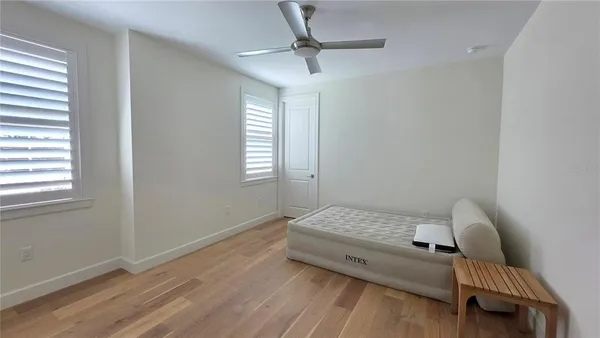 a bedroom with a bed and window