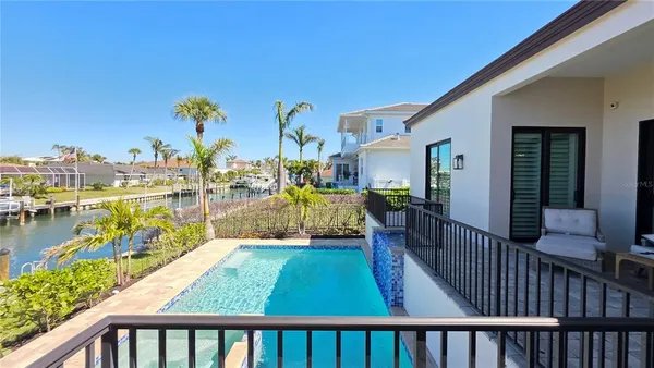 a view of swimming pool from a balcony